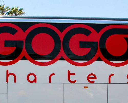Exterior of a luxury bus that reads "GoGo Charters"