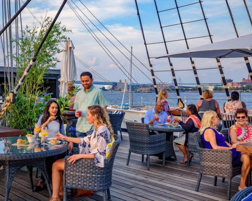 people dining on dock at moshulu
