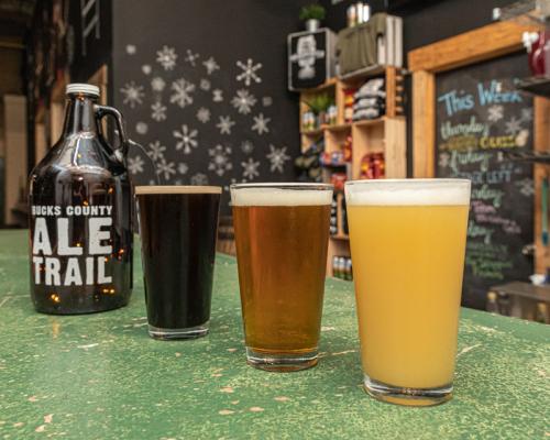 beer pours in glass placed on table