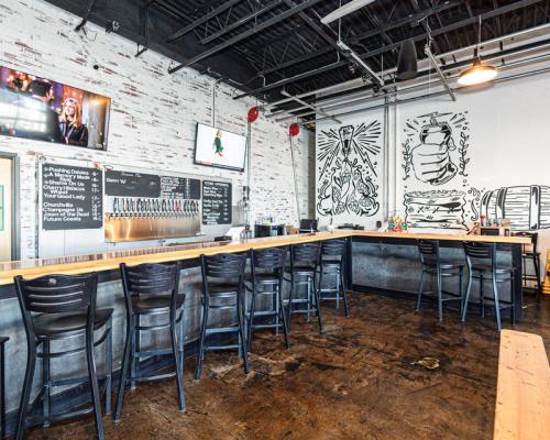 Indoor seating by wall Neshaminy Creek Brewing Company