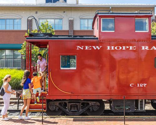 Family getting into Rail car at New Hope Railroad