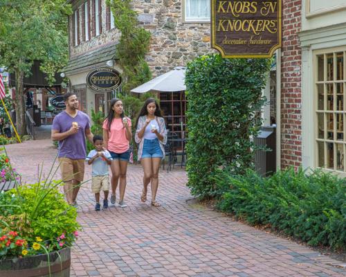 family walking around shops in Peddler village