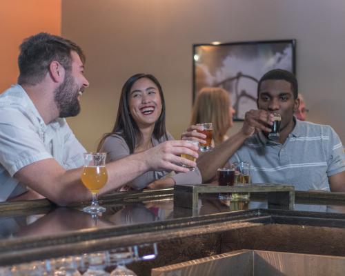 patrons drinking beer at proper brewing beer