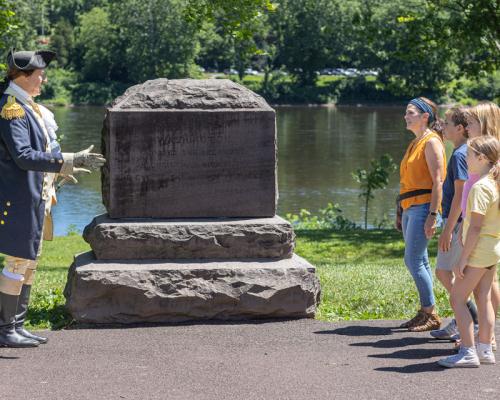 visitor getting a guided tour at washington Crossing historic park in Bucks County