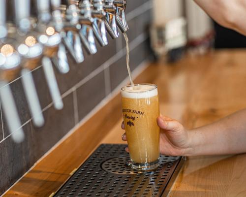 Beer pour from tap at Warwick farm brewing